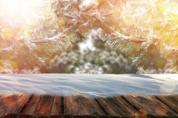 Wall Mural - A table full of snowflakes with empty space with Winter landscape of trees covered with snow.
