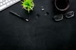 © 9dreamstudio - Black strict office desk, monochrome. Computer keyboard, glasses, coffee. Top view copy space