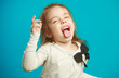 © Ilshat - Cute little girl in white T-shirt makes funny face and shows tongue
