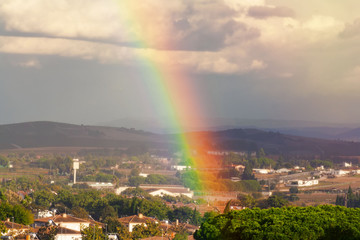 Very beautiful rainbow over the city after the rain.