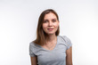 © satura_ - People and education concept - Close up portrait of lovely girl in grey shirt over white background