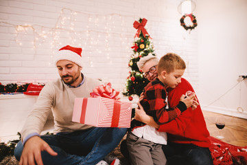 Wall Mural - Happy family christmas eve. Christmas friends.