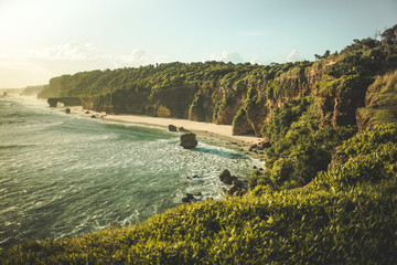 panorama ocean coastline, green-capped cliff. indonesia. spectacular oceanscape the shore surrounded