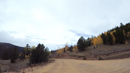 Aufkleber - Driving on small mountain dirt roads from Colorado Springs to Cripple Creek in Autumn.
