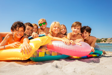 Wall Mural - Happy kids spending summer vacation on the beach