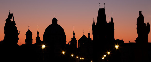 Wall Mural - Praghe - The silhouette of the Town from Charles bridge in the morning.