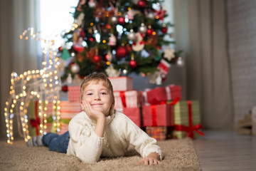 boy near the Christmas tree