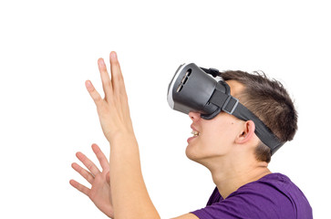 Portrait of a young man in a purple t-shirt experiencing virtual reality with the help of WR glasses.