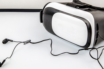 virtual reality glasses with a headset are on the table