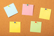 © k_samurkas - colorful papers pined with tacks on brown cork board background