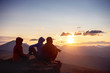 © cppzone - Three friends sits mountains top sunset view