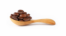 Wooden Spoon Of Roasted Coffee Beans On White
