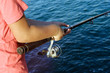 © elena - Teenage boy fishing in the sea, summer