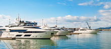 Panoramic View Of Sea Port With Group Of Luxury Yachts At Blue Sea Background