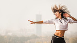 Zumba dance fitness instructor doing sport aerobic exercises. Motivational coach