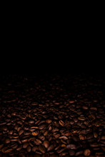 Heap Of Coffee Beans In A Dark, With Black Copy Space Above
