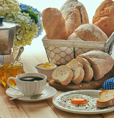 breakfast with egg, bread toast and coffe