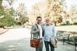 © bnenin - Outdoor portrait of friendly elegant young and senior men.