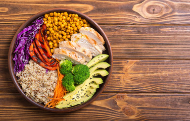 Wall Mural - Buddha bowl with avocado , chicken , pepper , quinoa and chickpea