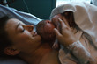 © Stocksy - Brand new mother and child after delivery in hospital room