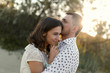 © Stocksy - Couple embracing?in sunset