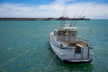 Canvas Print - seascape with a boat on the background of the sea.