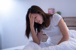 © torwaiphoto - Asian woman have a headaches may be migraines in the morning on the bed