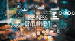 © Tierney - Business development with blurred city abstract lights background