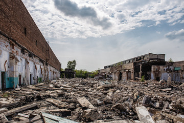 Wall Mural - Earthquake or war aftermath or hurricane or other natural disaster, broken ruined industrial buildings, pills of concrete garbage