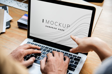 business people working on a laptop with a screen mockup