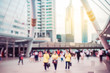 © TeTe Song - Blurred background. Blurred people walking through a city street on sunset of an urban landscape