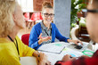 © pressmaster - Young confident analyst in casualwear explaining her ideas about successful development of their business