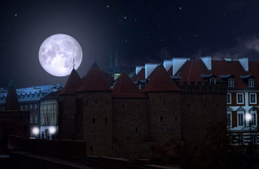 full moon over the old city in warsaw