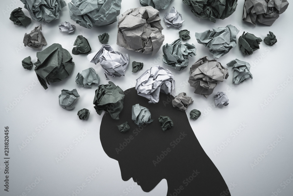Silhouette of troubled person head. Concept image of anxiety and negative emotion. Waste paper and head silhouette. - obrazy, fototapety, plakaty 