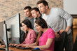 © Pixel-Shot - Young people playing video games at tournament