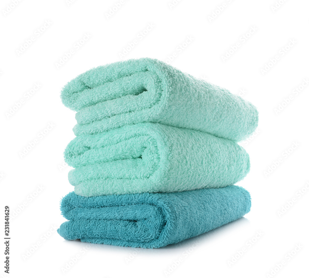 Stack of clean soft towels on white background