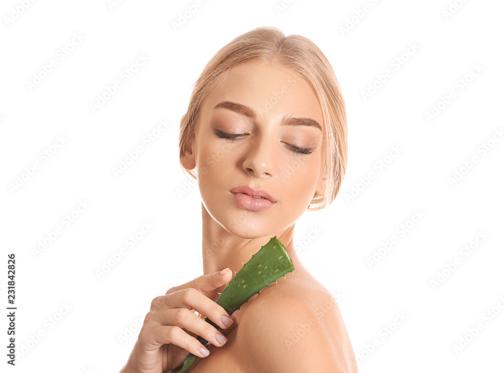 Beautiful young woman with aloe vera on white background