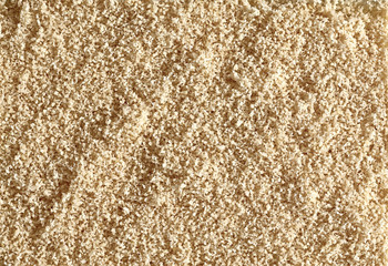 Wall Mural - Almond granulated, milled or crushed flour from top view