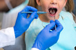 © LIGHTFIELD STUDIOS - cropped shot of dentist examining teeth of little child