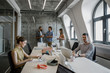 © LUMINA IMAGES - Group of young businessmen and businesswomen working together at modern office.
