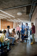 © LUMINA IMAGES - Group of businesswomen and businessmen having a meeting at modern open space office.