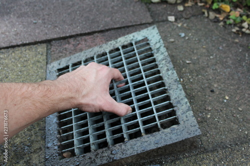 Hand Hebt Abflussgitter Buy This Stock Photo And Explore Similar