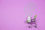 Fototapeta Mapy - Pills in shopping cart on blue background. The concept: trade in medicines, pharmacies.