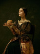 © master1305 - Portrait of a girl wearing a princess or countess dress over dark studio. portrait with burger