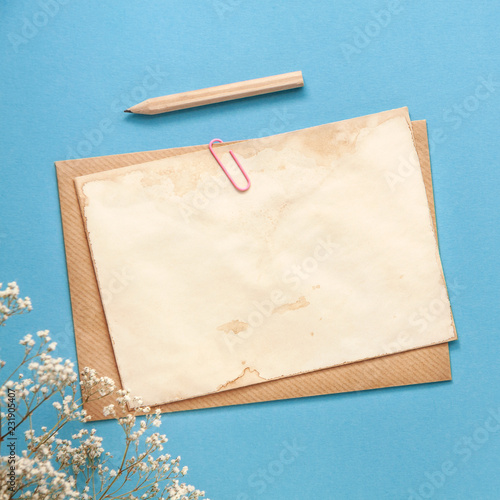 Download A Blue Card With Copy Space Wooden Pencil White Flowers And An Envelope With An Old Paper Mockup Buy This Stock Photo And Explore Similar Images At Adobe Stock Adobe Stock PSD Mockup Templates