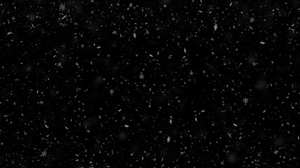 Snowflakes falling on black background