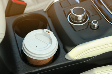 Canvas Print - Takeaway paper coffee cup in holder inside car