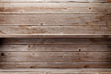 Wall Mural - Empty wooden shelves in front of wooden wall