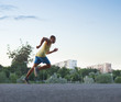 © Stocksy - Sporty man sprint running pn track outdoor in urban scene
