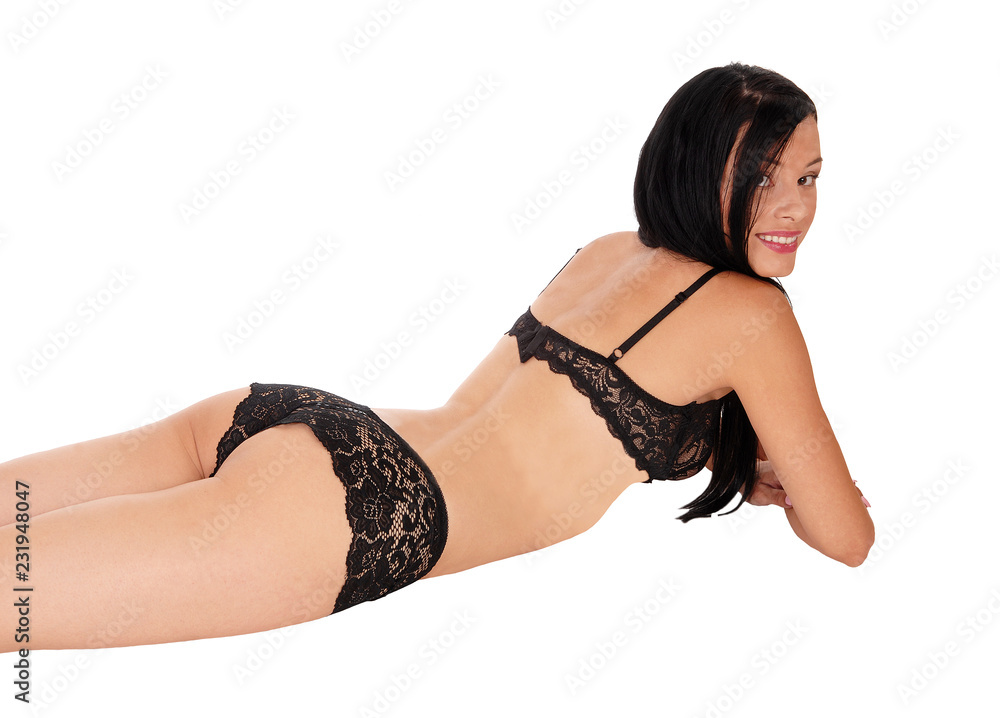 Woman lying in black lingerie on her stomach, smiling Stock Photo | Adobe  Stock